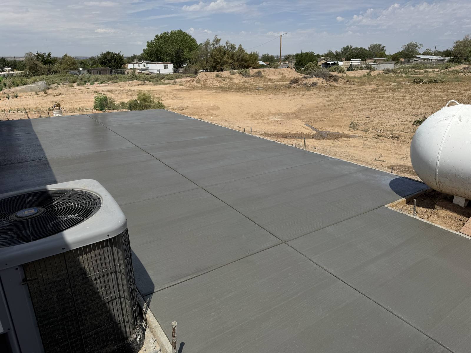Concrete pad beside a mobile home